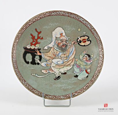 CHINA
Glazed earthenware round dish with...