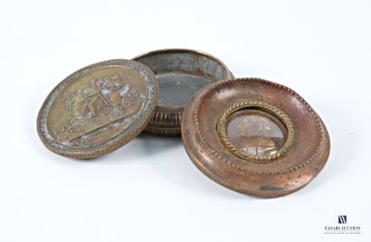 Set comprising a round brass box featuring...