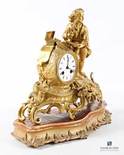 Gilded regule clock, with white enameled...