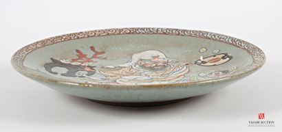 CHINA
Glazed earthenware round dish with...