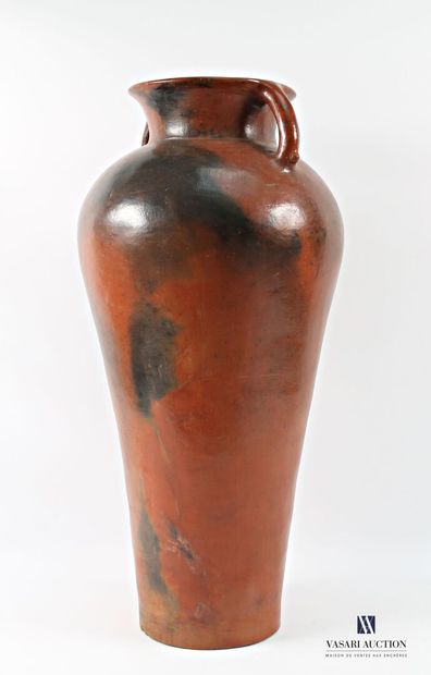 A truncated cone-shaped amphora in patinated...