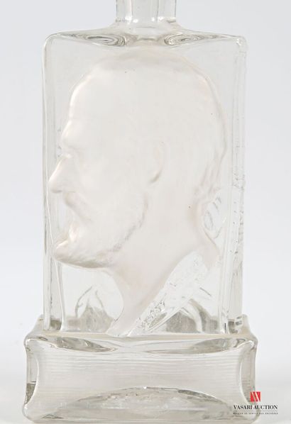 Glass bottle with molded decoration in the...