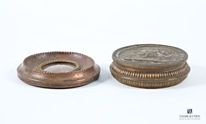 Set comprising a round brass box featuring...