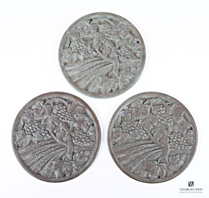 Three cast-iron medallions depicting vine...