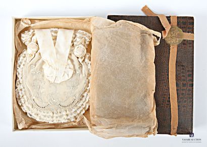 Embroidered fabric and lace purse decorated...