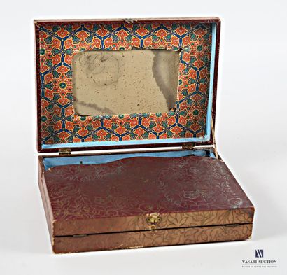 Dark wood box with paper embossed with flower...