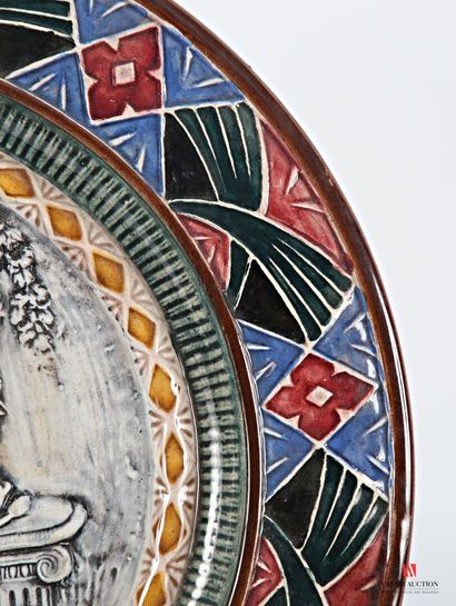 Barbotine round dish decorated in the basin...