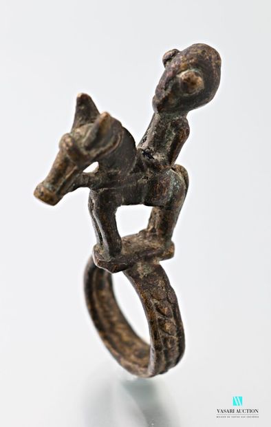 Copper alloy ring surmounted by a horseman...