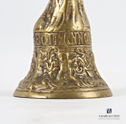 Bronze bell featuring a female bust, the...