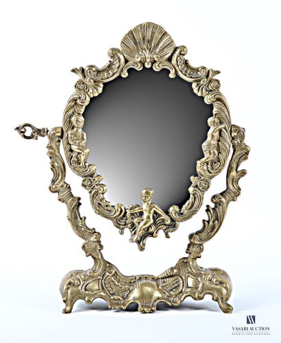 A bronze psyche table mirror, with a curved...