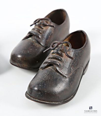 Set of two pairs of cast-iron shoes. 
(scratches,...