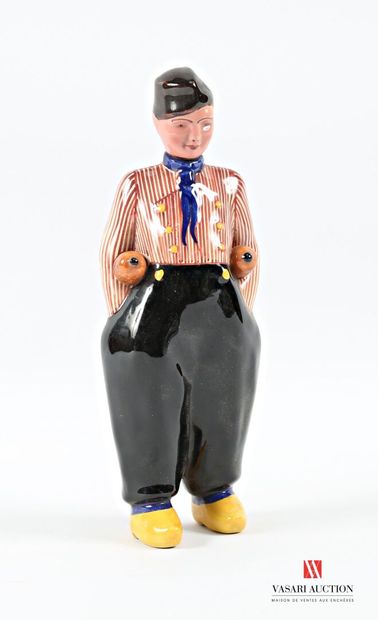 Ceramic bottle featuring a robed man carrying...