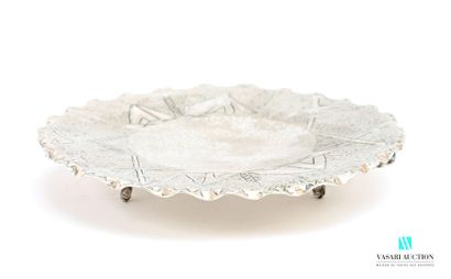 Round-shaped trivet in hammered metal decorated...