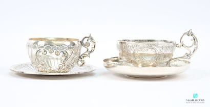 Two silver-plated coffee cups and saucers...