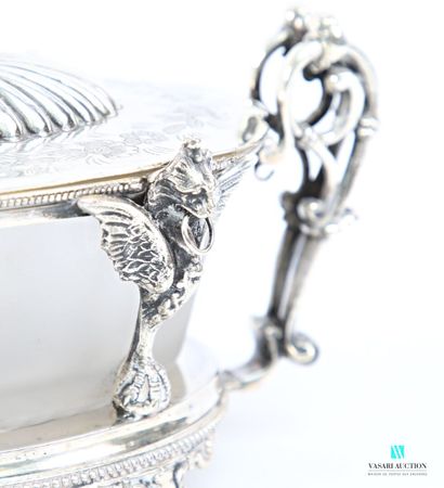 Oval-shaped silver-plated sugar bowl standing...