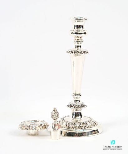A pair of silver-plated candlesticks on a...