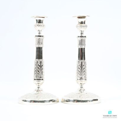 Pair of silver-plated candlesticks standing...