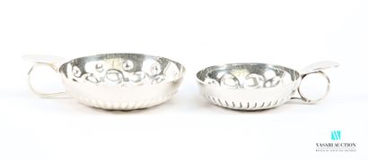 Two silver-plated wine tastes, the body decorated...