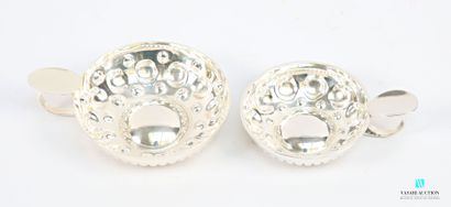 Two silver-plated wine tastes, the body decorated...