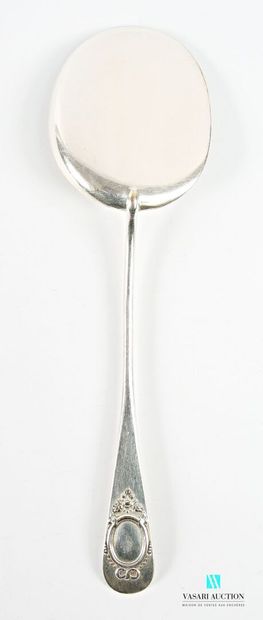 A silver-plated serving spoon with a plain...