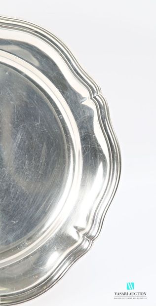 Round dish in silver-plated metal, the scalloped...