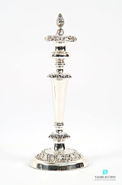 A pair of silver-plated candlesticks on a...