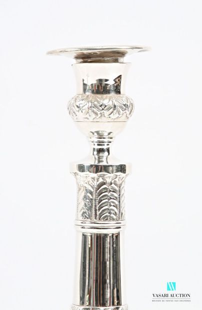 Pair of silver-plated candlesticks standing...