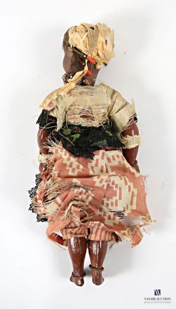 Porcelain-headed doll depicting a woman in...