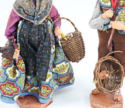 Set of two terracotta santons depicting a...