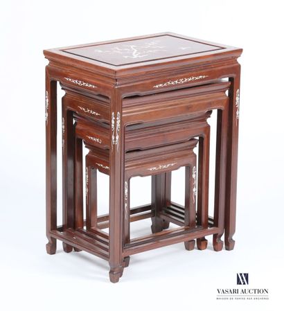 CHINA
A set of four nesting tables made of...
