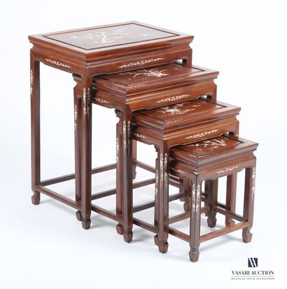 CHINA
A set of four nesting tables made of...