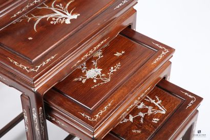 CHINA
A set of four nesting tables made of...