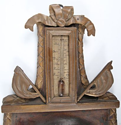 Barometer-thermometer in carved wood, brown...