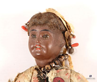 Porcelain-headed doll depicting a woman in...