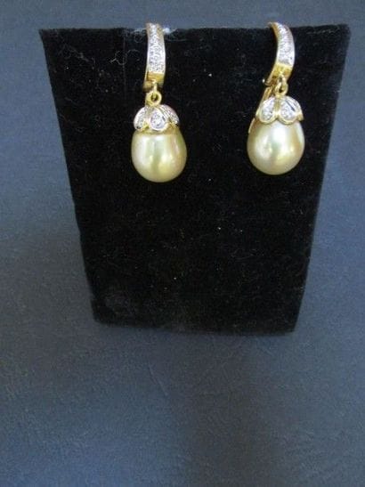 Paire de pendants d’oreille en or jaune en

arcade,...