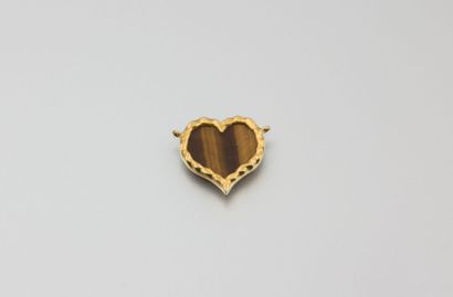 Pendentif en or jaune à motif en coeur,

agrémenté...