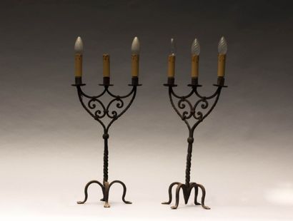 Paire de candélabres en fer forgé à trois

bras...