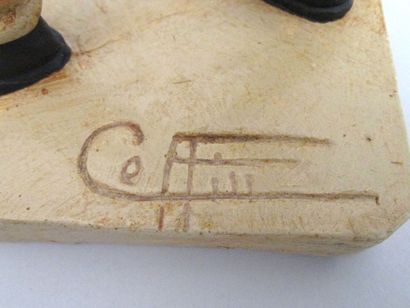 COFFIN. Statuette de platre polychrome signée...