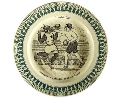 Assiette décorative en faïence de St Amand,...