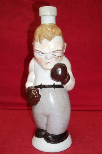 Boxeur en porcelaine allemande formant bouteille....
