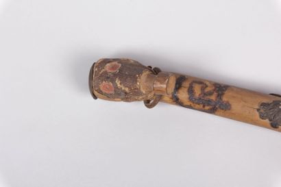 Canne de soldat, le pommeau sculpté d’un

masque...