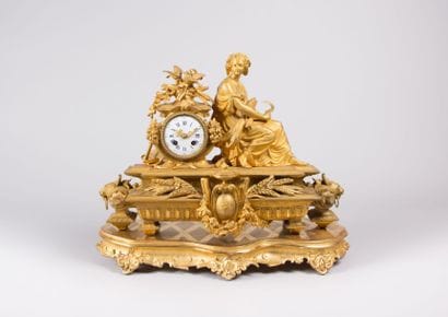 Pendule en régule doré, le cadran émaillé

à...