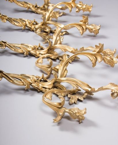 Suite de quatre appliques en bronze doré,...