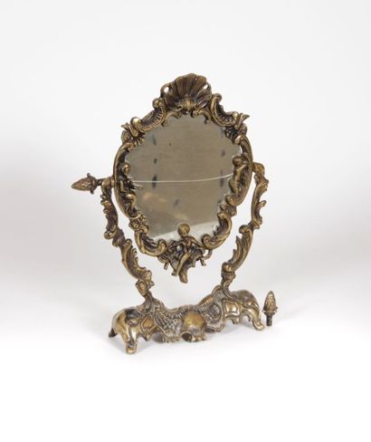 Miroir psyché en bronze posant sur une base...