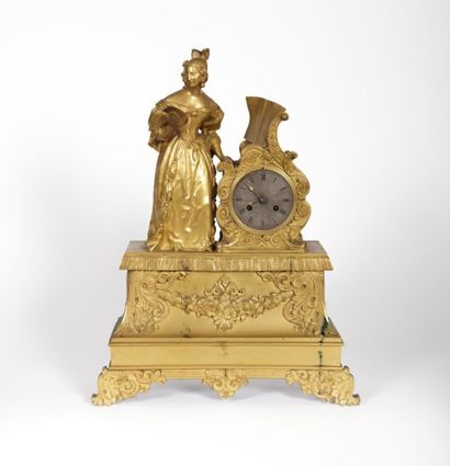 Pendule en bronze le cadran de forme ronde...