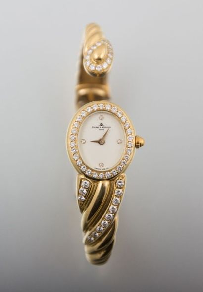 Montre de dame Baume & Mercier en

or jaune,...