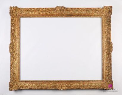 Cadre en bois et stuc mouluré, sculpté et...