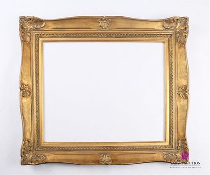 Cadre en bois et stuc mouluré, sculpté et...