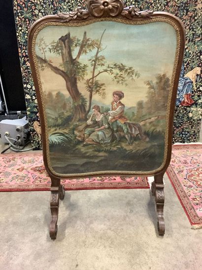 Large molded and carved walnut fire screen...