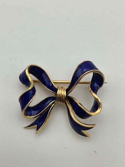 Or jaune 750 millièmes comprenant une broche...